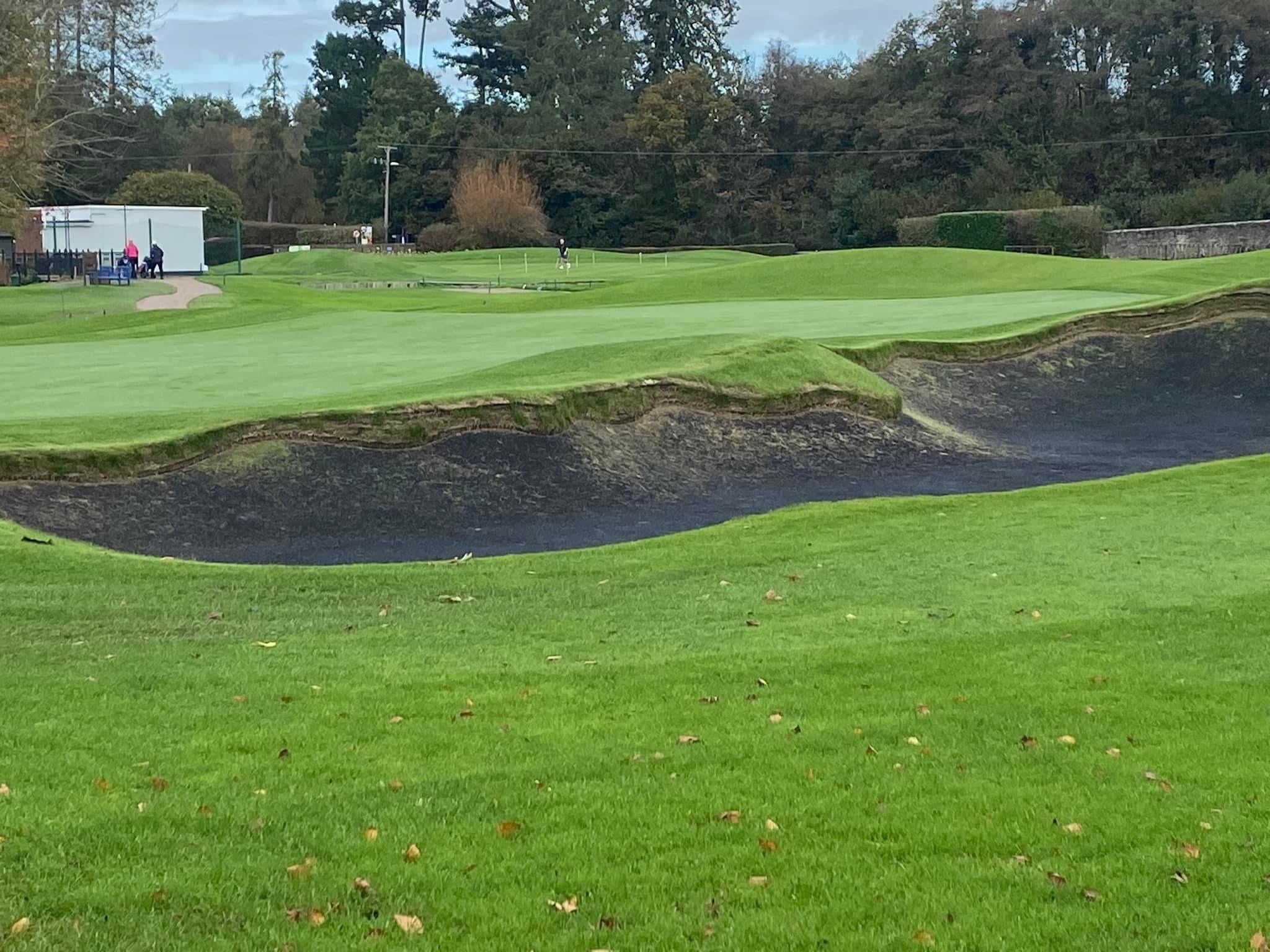 Are there any tools that can assist with practicing bunker shots and improving sand play?