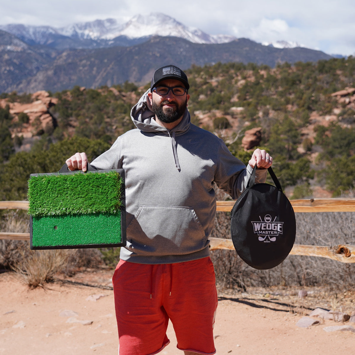 Man holding the Wedge Master mat and carrying case