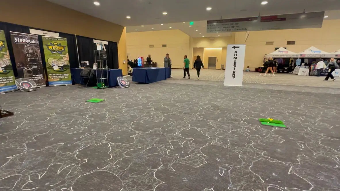 DDSports expo booth with StoolPak and Wedge Master banners and nets